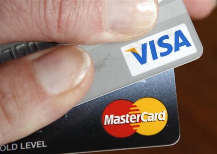 A credit card user displays her cards in Washington February 22, 2010. REUTERS/Kevin Lamarque A credit card user displays her cards in Washington February 22, 2010. REUTERS/Kevin Lamarque