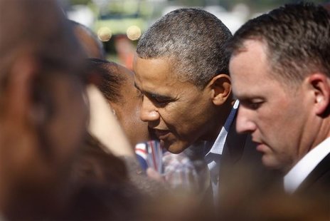 U.S. President Barack Obama gets a kiss from a woman in the crowd as he arrives at Newport News/Williamsburg International Airport in Willia U.S. President Barack Obama gets a kiss from a woman in the crowd as he arrives at Newport News/Williamsburg International Airport in Willia