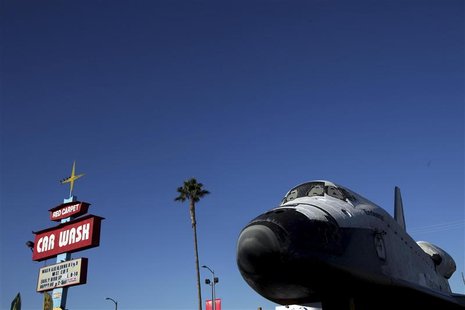 Space Shuttle Endeavour moves down Martin Luther King Blvd. on the last leg of its journey to the California Science Center at Exposition Pa Space Shuttle Endeavour moves down Martin Luther King Blvd. on the last leg of its journey to the California Science Center at Exposition Pa