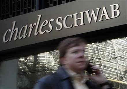 A man walks past a Charles Schwab Investment branch in Washington January 19, 2010. REUTERS/Jim Young A man walks past a Charles Schwab Investment branch in Washington January 19, 2010. REUTERS/Jim Young