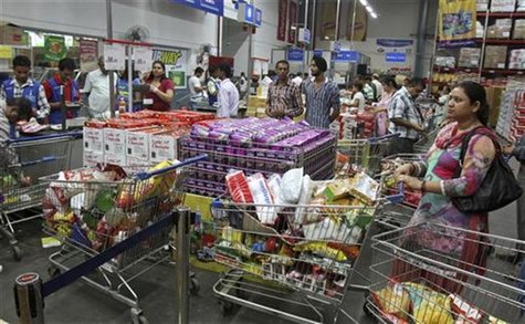 Customers wait to pay for their goods at a Best Price Modern Wholesale store, a joint venture of Wal-Mart Stores Inc and Bharti Enterprises, Customers wait to pay for their goods at a Best Price Modern Wholesale store, a joint venture of Wal-Mart Stores Inc and Bharti Enterprises,