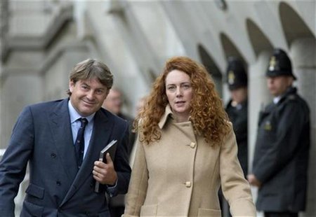 Former News International chief executive Rebekah Brooks and her husband Charlie leave the Old Bailey court in London September 26, 2012. RE Former News International chief executive Rebekah Brooks and her husband Charlie leave the Old Bailey court in London September 26, 2012. RE