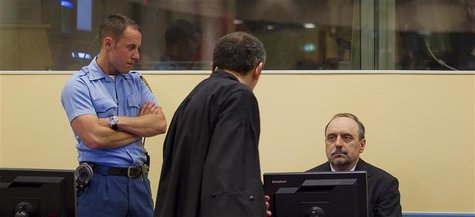 Goran Hadzic, the last of Serbia's suspected war criminals makes his initial appearance to stand trial on crimes against humanity at the Int Goran Hadzic, the last of Serbia's suspected war criminals makes his initial appearance to stand trial on crimes against humanity at the Int