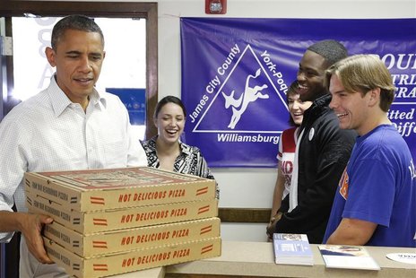 U.S. President Barack Obama delivers pizza to volunteers at his campaign office in Williamsburg, Virginia, October 14, 2012. REUTERS/Jonatha U.S. President Barack Obama delivers pizza to volunteers at his campaign office in Williamsburg, Virginia, October 14, 2012. REUTERS/Jonatha