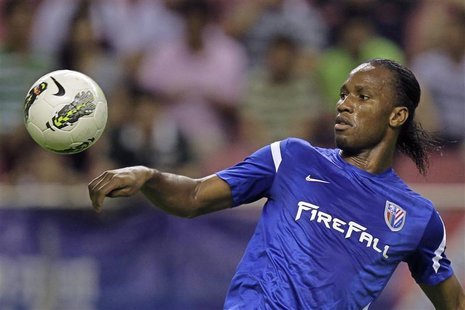 Shanghai Shenhua's striker Didier Drogba controls the ball during the Chinese Super League match against Hangzhou green town at the Shanghai Shanghai Shenhua's striker Didier Drogba controls the ball during the Chinese Super League match against Hangzhou green town at the Shanghai