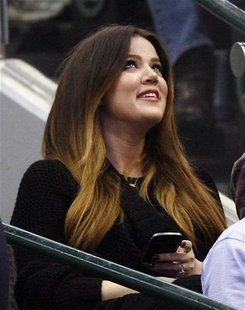 Reality star Khloe Kardashian, wife of Dallas Mavericks forward Lamar Odom, watches from the audience during the first half of their NBA bas Reality star Khloe Kardashian, wife of Dallas Mavericks forward Lamar Odom, watches from the audience during the first half of their NBA bas