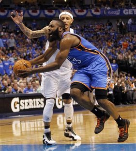 Oklahoma City Thunder guard James Harden (R) drives on Dallas Mavericks guard Delonte West during the second half of their NBA Western Confe Oklahoma City Thunder guard James Harden (R) drives on Dallas Mavericks guard Delonte West during the second half of their NBA Western Confe
