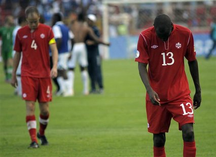 Canada's Kevin McKenna (L) and Atiba Hutchinson react after their team's loss against Honduras during their 2014 World Cup qualifying soccer Canada's Kevin McKenna (L) and Atiba Hutchinson react after their team's loss against Honduras during their 2014 World Cup qualifying soccer