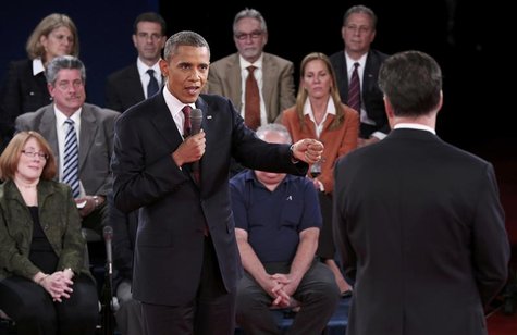 U.S. President Barack Obama (L) gestures towards Republican presidential nominee Mitt Romney as he answers a question during the second U.S. U.S. President Barack Obama (L) gestures towards Republican presidential nominee Mitt Romney as he answers a question during the second U.S.