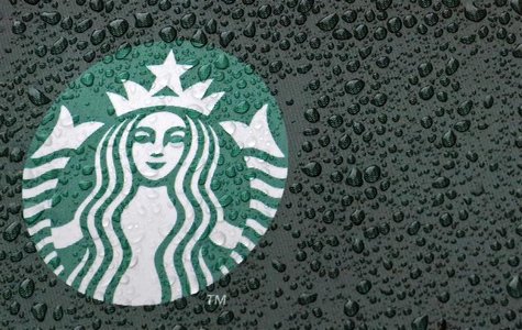 Raindrops are seen on the Starbucks logo on a signage at a branch of the coffee shop chain in London October 8, 2012. Picture taken October Raindrops are seen on the Starbucks logo on a signage at a branch of the coffee shop chain in London October 8, 2012. Picture taken October