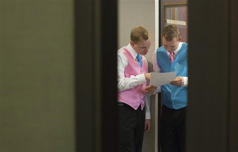 Dale Frost (L) and Mark Massey read their wedding certificate at the City Clerk's Office in New York October 11, 2012. REUTERS/Andrew Kelly Dale Frost (L) and Mark Massey read their wedding certificate at the City Clerk's Office in New York October 11, 2012. REUTERS/Andrew Kelly