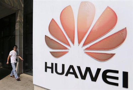 A man walks past a Huawei company logo outside the entrance of a Huawei office in Wuhan, Hubei province October 9, 2012. REUTERS/Stringer A man walks past a Huawei company logo outside the entrance of a Huawei office in Wuhan, Hubei province October 9, 2012. REUTERS/Stringer