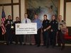 Northern Lights Foundation President Ken Larson receives a check