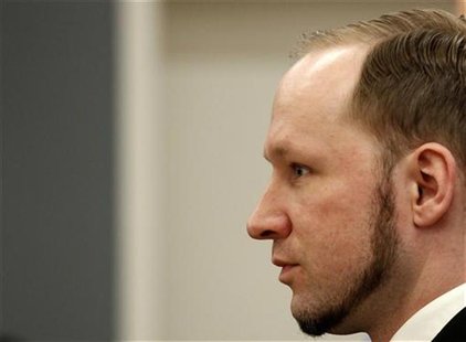 Norwegian mass killer Anders Behring Breivik reacts as he returns after a break to the court room, in Oslo Courthouse August 24, 2012. REUTE Norwegian mass killer Anders Behring Breivik reacts as he returns after a break to the court room, in Oslo Courthouse August 24, 2012. REUTE