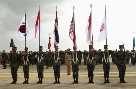 Thai soldiers carry national flags as they participate in the opening ceremony of the annual joint "Cobra Gold 2010" (CG10) military exercis Thai soldiers carry national flags as they participate in the opening ceremony of the annual joint "Cobra Gold 2010" (CG10) military exercis