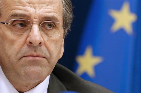 Greece's Prime Minister Antonis Samaras attends a news conference at the end of the second session of a two-day European Union leaders summi Greece's Prime Minister Antonis Samaras attends a news conference at the end of the second session of a two-day European Union leaders summi