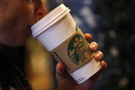 A customer sips her coffee in Starbucks' Mayfair Vigo Street branch in central London September 12, 2012. Picture taken September 12, 2012. A customer sips her coffee in Starbucks' Mayfair Vigo Street branch in central London September 12, 2012. Picture taken September 12, 2012.