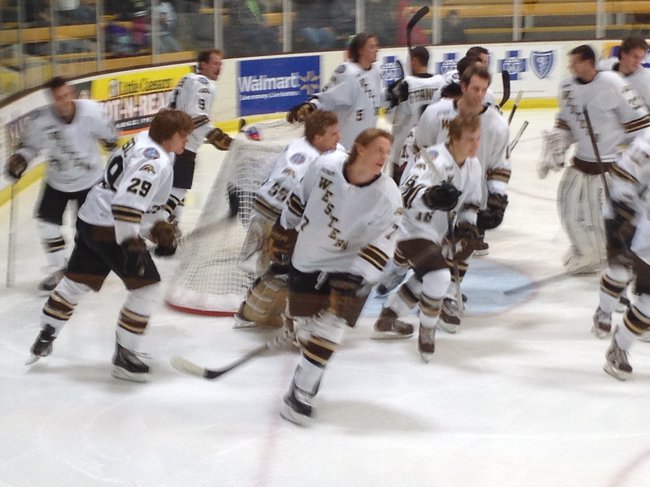 Western Michigan Broncos hockey team skates back to the bench following their warm up session.