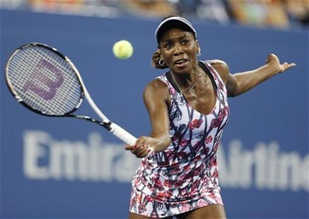 Venus Williams of the U.S. hits a return to Angelique Kerber of Germany during their match at the U.S. Open women's singles tennis tournamen Venus Williams of the U.S. hits a return to Angelique Kerber of Germany during their match at the U.S. Open women's singles tennis tournamen