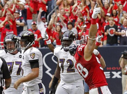 Houston Texans linebacker Connor Barwin (98) celebrates after sacking Baltimore Ravens quarterback Joe Flacco (L) in the end zone for a safe Houston Texans linebacker Connor Barwin (98) celebrates after sacking Baltimore Ravens quarterback Joe Flacco (L) in the end zone for a safe