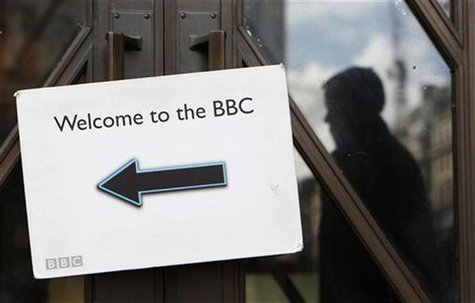 A pedestrian is reflected in a door as they walk past the BBC Broadcasting House in London October 18, 2012. REUTERS/Suzanne Plunkett A pedestrian is reflected in a door as they walk past the BBC Broadcasting House in London October 18, 2012. REUTERS/Suzanne Plunkett