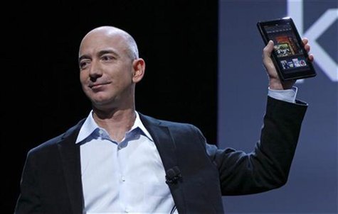 Amazon CEO Jeff Bezos holds up the new Kindle Fire at a news conference during the launch of Amazon's new tablets in New York, September 28, Amazon CEO Jeff Bezos holds up the new Kindle Fire at a news conference during the launch of Amazon's new tablets in New York, September 28,