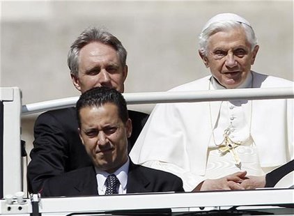 The Pope's butler, Paolo Gabriele (bottom L) arrives with Pope Benedict XVI (R) at St. Peter's Square in Vatican, in this file photo taken M The Pope's butler, Paolo Gabriele (bottom L) arrives with Pope Benedict XVI (R) at St. Peter's Square in Vatican, in this file photo taken M