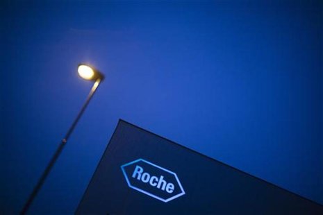 A logo of Swiss pharmaceutical company Roche is pictured in front of a company's building in Rotkreuz, April 12, 2012. REUTERS/Michael Buhol A logo of Swiss pharmaceutical company Roche is pictured in front of a company's building in Rotkreuz, April 12, 2012. REUTERS/Michael Buhol
