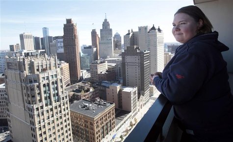 Jeanette Pierce stands on an outside balcony in the high-rise apartment building she lives in downtown Detroit, Michigan on October 16, 2012 Jeanette Pierce stands on an outside balcony in the high-rise apartment building she lives in downtown Detroit, Michigan on October 16, 2012