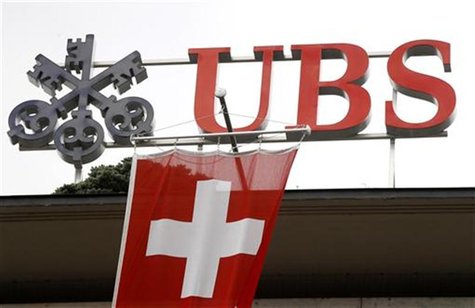 A Switzerland national flag flies in front of the logo of Swiss bank UBS at the company's headquarters in Zurich April 13, 2012. REUTERS/Arn A Switzerland national flag flies in front of the logo of Swiss bank UBS at the company's headquarters in Zurich April 13, 2012. REUTERS/Arn