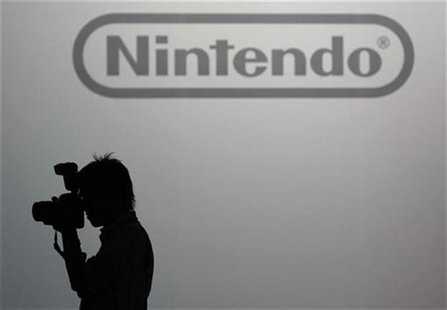 A photographer takes pictures in front of the logo of Nintendo Co Ltd at its news conference in Tokyo October 2, 2008. REUTERS/Kim Kyung-Hoo A photographer takes pictures in front of the logo of Nintendo Co Ltd at its news conference in Tokyo October 2, 2008. REUTERS/Kim Kyung-Hoo