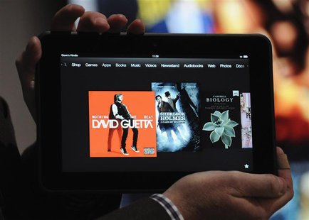 An employee demonstrates the new Kindle Fire HD 8.9" at Amazon's Kindle Fire event in Santa Monica, California September 6, 2012. REUTERS/Gu An employee demonstrates the new Kindle Fire HD 8.9" at Amazon's Kindle Fire event in Santa Monica, California September 6, 2012. REUTERS/Gu