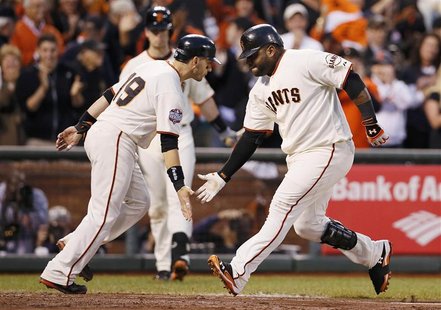 San Francisco Giants' Pablo Sandoval (R) celebrates with teammate Marco Scutaro after hitting a two RBI home run against the Detroit Tigers San Francisco Giants' Pablo Sandoval (R) celebrates with teammate Marco Scutaro after hitting a two RBI home run against the Detroit Tigers