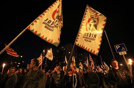 Supporters of the Hungarian far right Jobbik party march during a demonstration at the Avas apartment projects in Miskolc, 180 km (112 miles Supporters of the Hungarian far right Jobbik party march during a demonstration at the Avas apartment projects in Miskolc, 180 km (112 miles