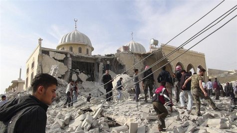 Residents and members of the Free Syrian Army inspect Bilal mosque, which activists said was damaged after it was fired by a Syrian Air Forc Residents and members of the Free Syrian Army inspect Bilal mosque, which activists said was damaged after it was fired by a Syrian Air Forc