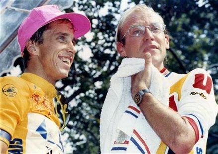 Greg LeMond of the U.S. (L) and Tour de France leader Laurent Fignon of France stand on the podium at the end of the Tour de France cycling Greg LeMond of the U.S. (L) and Tour de France leader Laurent Fignon of France stand on the podium at the end of the Tour de France cycling