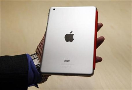 A visitor looks over the new iPad mini at an Apple event in San Jose, California October 23, 2012. REUTERS/Robert Galbraith A visitor looks over the new iPad mini at an Apple event in San Jose, California October 23, 2012. REUTERS/Robert Galbraith