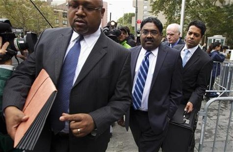 Galleon hedge fund founder Raj Rajaratnam (C) departs Manhattan Federal Court after his sentencing in New York October 13, 2011. REUTERS/Luc Galleon hedge fund founder Raj Rajaratnam (C) departs Manhattan Federal Court after his sentencing in New York October 13, 2011. REUTERS/Luc