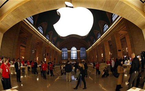 The Apple Inc. logo hangs inside the newest Apple Store in New York City's Grand Central Station December 7, 2011, during a press preview of The Apple Inc. logo hangs inside the newest Apple Store in New York City's Grand Central Station December 7, 2011, during a press preview of