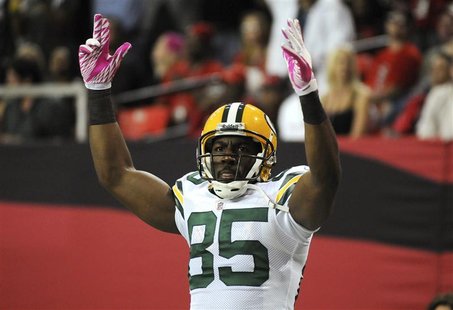 Green Bay Packers' wide receiver Greg Jennings celebrates a touchdown in the second half of their NFL football game against the Atlanta Falc Green Bay Packers' wide receiver Greg Jennings celebrates a touchdown in the second half of their NFL football game against the Atlanta Falc