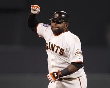 San Francisco Giants' Pablo Sandoval celebrates his third home run of the game against the Detroit Tigers in the fifth inning during Game 1 of the MLB World Series baseball championship in San Francisco, October 24, 2012. REUTERS/Robert Galbraith San Francisco Giants' Pablo Sandoval celebrates his third home run of the game against the Detroit Tigers in the fifth inning during Game 1 of the MLB World Series baseball championship in San Francisco, October 24, 2012. REUTERS/Robert Galbraith