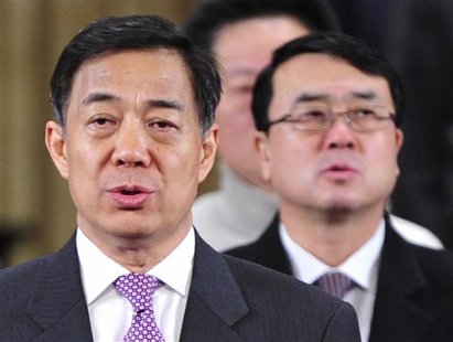 China's Chongqing Municipality Communist Party Secretary Bo Xilai (L) and Deputy Mayor of Chongqing Wang Lijun (R) sing the national anthem China's Chongqing Municipality Communist Party Secretary Bo Xilai (L) and Deputy Mayor of Chongqing Wang Lijun (R) sing the national anthem