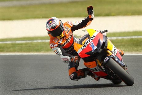 Honda MotoGP rider Casey Stoner of Australia waves during a free practice session ahead of the Australian Motorcycle Grand Prix at Phillip I Honda MotoGP rider Casey Stoner of Australia waves during a free practice session ahead of the Australian Motorcycle Grand Prix at Phillip I