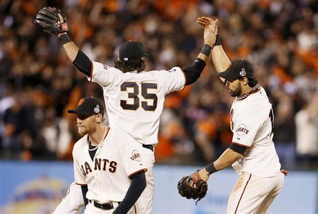 San Francisco Giants center fielder Angel Pagan (R) celebrates with teammates Brandon Crawford (35) and Hunter Pence after the Giants defeat San Francisco Giants center fielder Angel Pagan (R) celebrates with teammates Brandon Crawford (35) and Hunter Pence after the Giants defeat