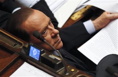 Former Italian Prime Minister Silvio Berlusconi looks on during a vote of confidence at the Lower House of Parliament in Rome November 18, 2 Former Italian Prime Minister Silvio Berlusconi looks on during a vote of confidence at the Lower House of Parliament in Rome November 18, 2