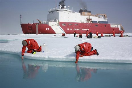 Scientists Jens Ehn (L) and Christie Wood scoop water from melt ponds on sea ice in the Chukchi Sea in the Arctic Ocean in this July 10, 201 Scientists Jens Ehn (L) and Christie Wood scoop water from melt ponds on sea ice in the Chukchi Sea in the Arctic Ocean in this July 10, 201