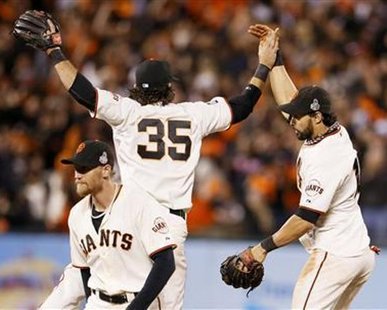 DRESS REHERSAL FOR WEEKEND?: San Francisco Giants center fielder Angel Pagan (R) celebrates with teammates Brandon Crawford (35) and Hunter Pence after the Giants defeated the Detroit Tigers in Game 2 of the MLB World Series baseball championship in San Francisco, October 25, 2012.
REUTERS/Lucy Nicholson DRESS REHERSAL FOR WEEKEND?: San Francisco Giants center fielder Angel Pagan (R) celebrates with teammates Brandon Crawford (35) and Hunter Pence after the Giants defeated the Detroit Tigers in Game 2 of the MLB World Series baseball championship in San Francisco, October 25, 2012.
REUTERS/Lucy Nicholson