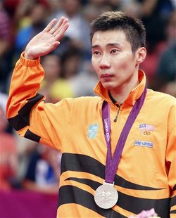Silver medallist Malaysia's Lee Chong Wei waves at the victory ceremony for the men's singles badminton event at the London 2012 Olympic Gam Silver medallist Malaysia's Lee Chong Wei waves at the victory ceremony for the men's singles badminton event at the London 2012 Olympic Gam