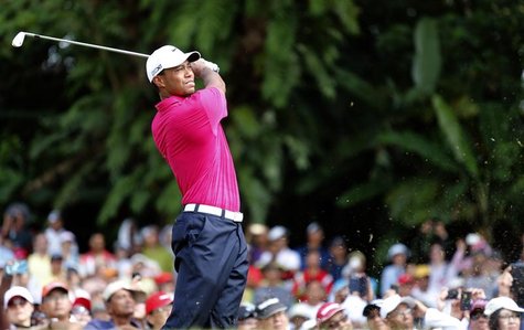 Tiger Woods of the U.S. tees off on the first hole during the third round of Malaysia's Asia Pacific Classic golf tournament in Kuala Lumpur Tiger Woods of the U.S. tees off on the first hole during the third round of Malaysia's Asia Pacific Classic golf tournament in Kuala Lumpur