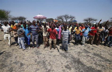 Striking platinum miners march near the Anglo-American Platinum (AMPLATS) mine near Rustenburg in South Africa's North West Province in this Striking platinum miners march near the Anglo-American Platinum (AMPLATS) mine near Rustenburg in South Africa's North West Province in this